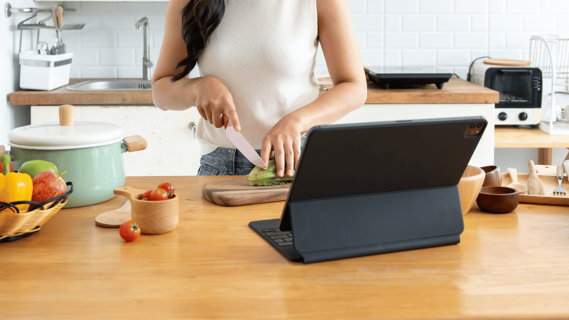 Hands hovering over a publish button with a family recipe card safely saved in Mealmento