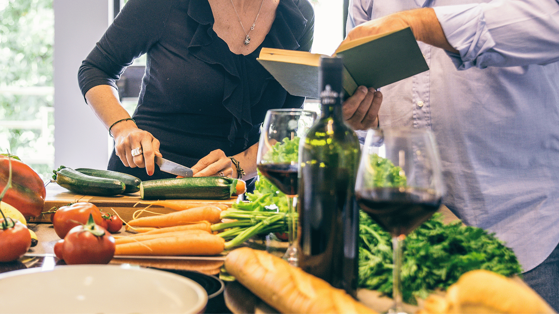 Family members around a table sharing food memories and stories with Mealmento